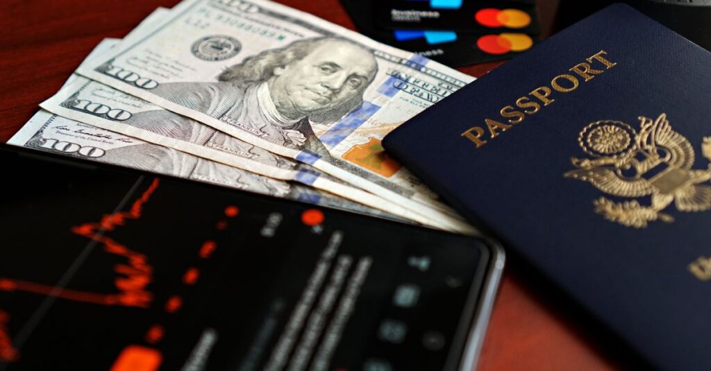 Image of financial elements including US dollars, passport, and digital representation of stock market trends.