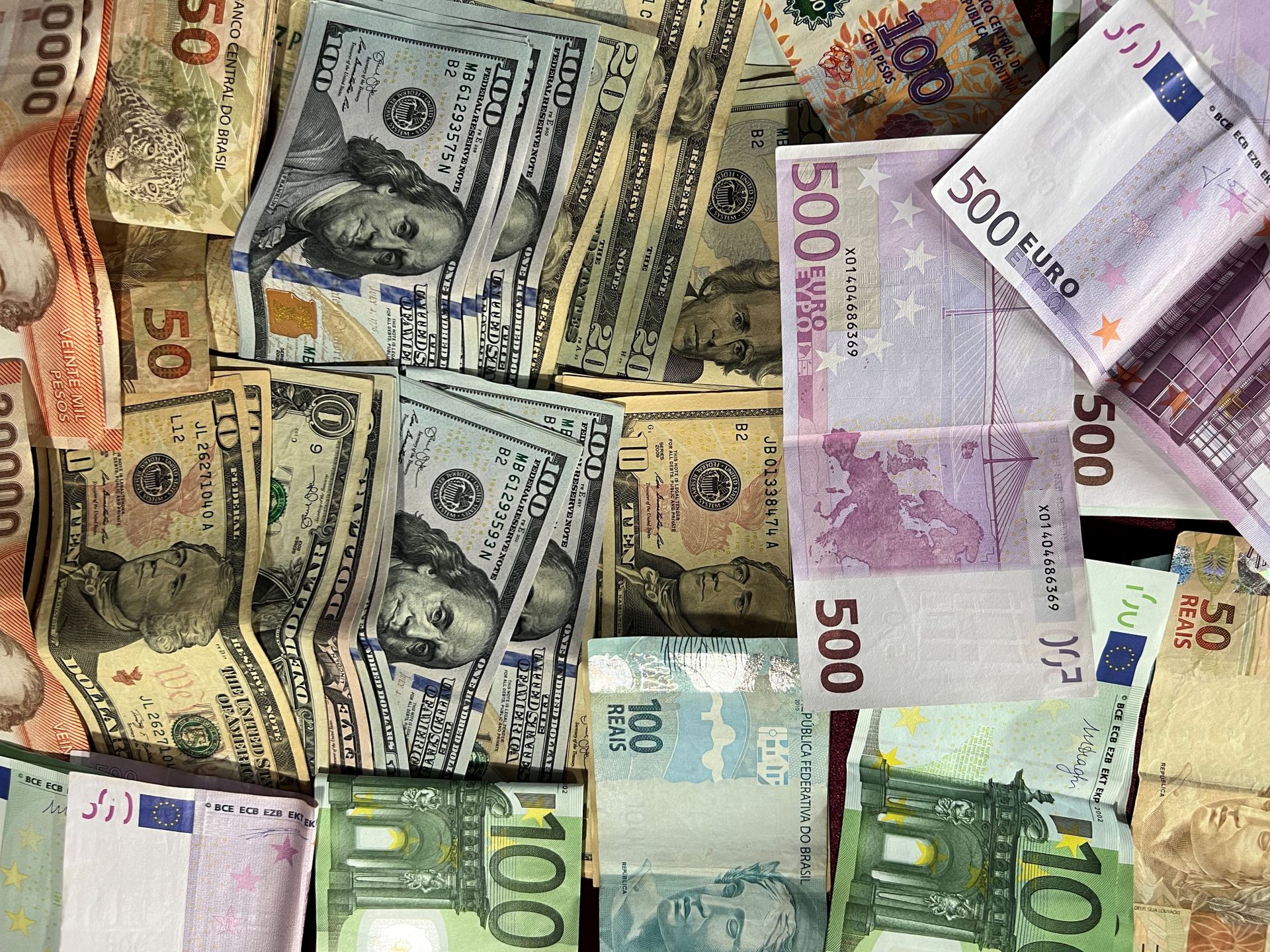 US dollars and other international banknotes representing sending money to Korea