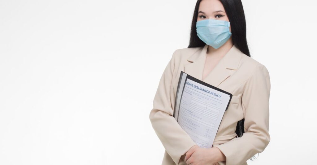 Professional woman wearing face mask holding insurance document, demonstrating safety and business.